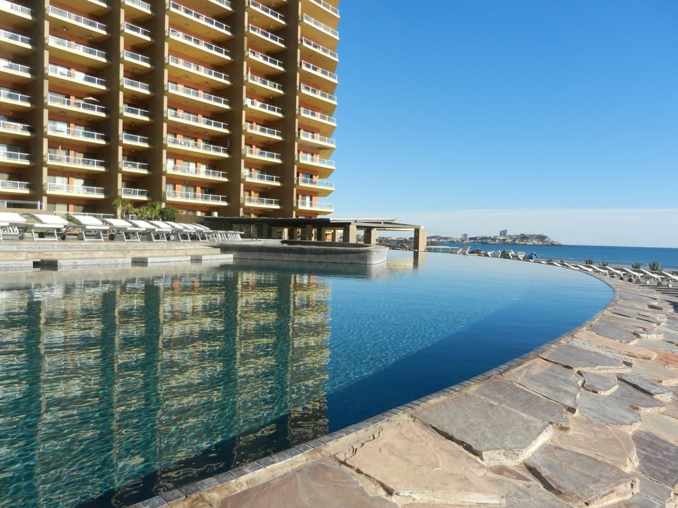 Coronado building reflecting in the negative edge pool.
