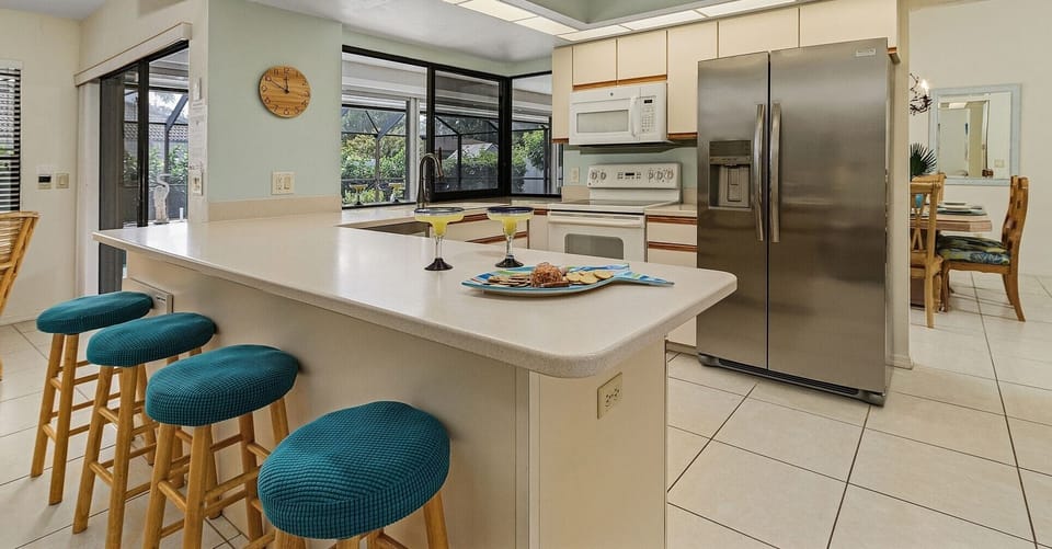 Enjoy some drinks and appetizers in the open concept kitchen and family room