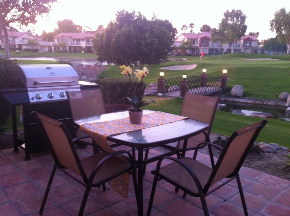 Patio view at dusk, overlooking the 5th hole. New BBQ and patio furniture added.