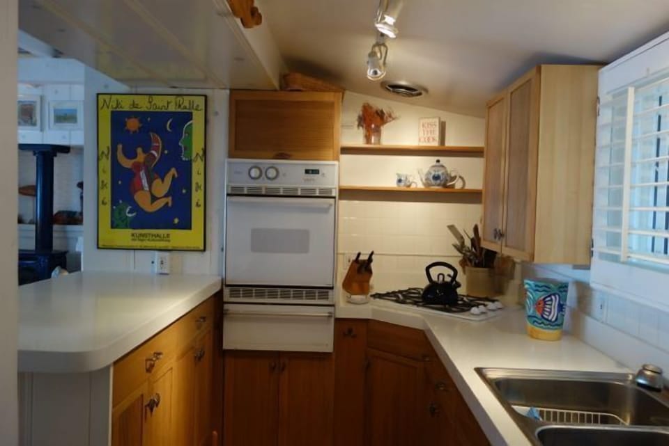 Galley kitchen with all of the conveniences.