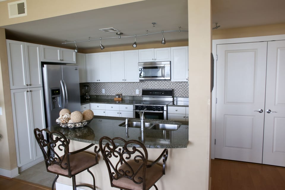 View from the kitchen sink of Galveston Bay. Stainless steel appliances. 