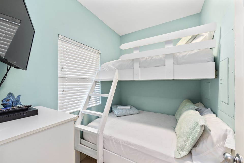 Bunk room with two twin beds, flat screen TV