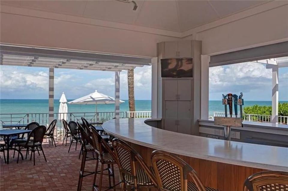 Grab a drink and a meal at the beach-front gazebo bar.