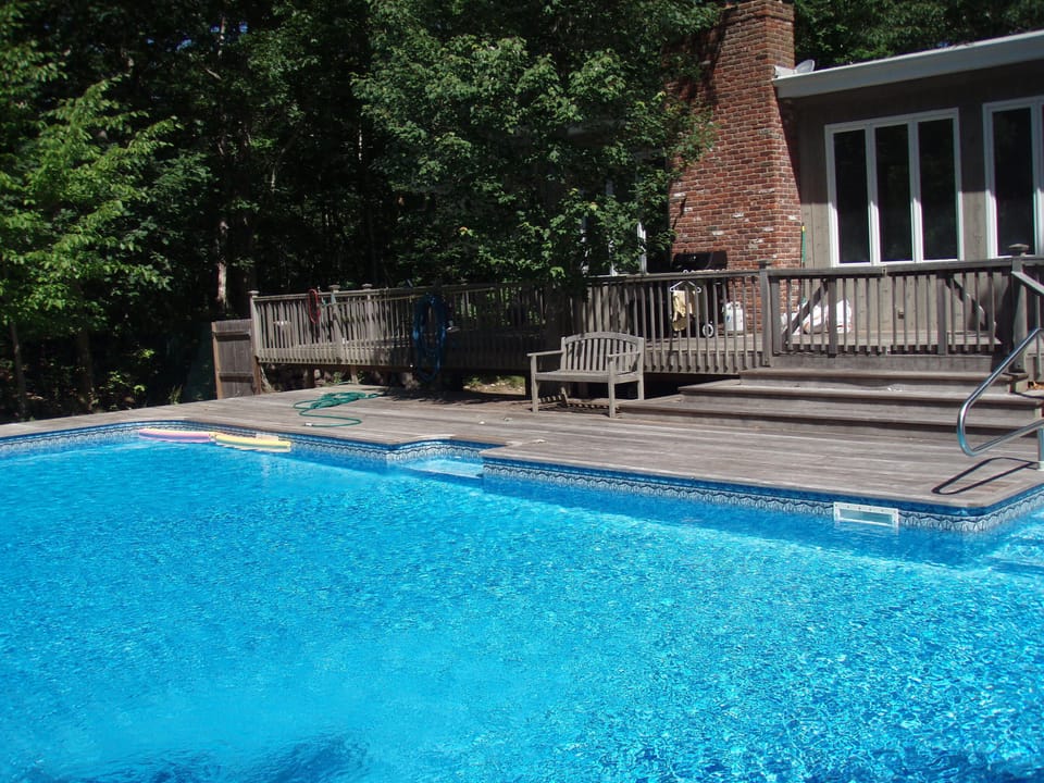 Large Swimming Pool with wrap around deck