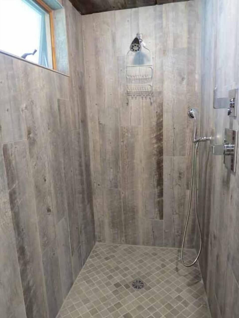 New large walk in master bathroom shower with additional hand shower