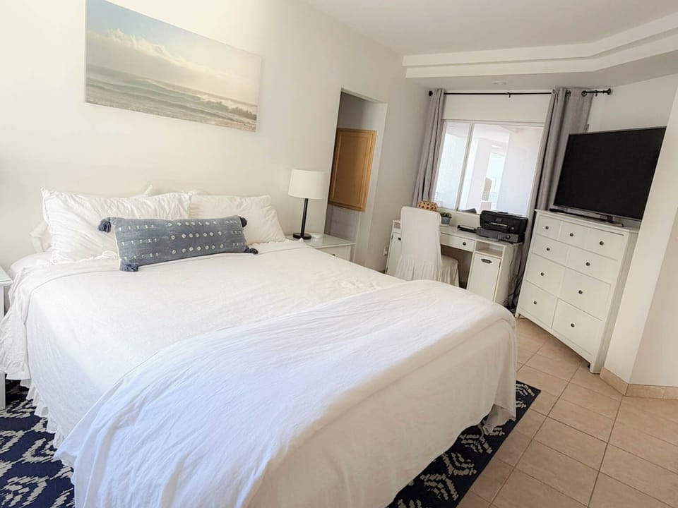 Den Open to Kitchen (Privacy Curtains) with King Bed and Attached Bathroom