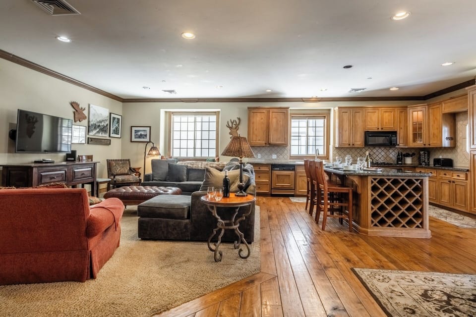 The Charming Chalet's open-concept layout connects the kitchen, dining, and living areas, making it easy to gather and spend time together.