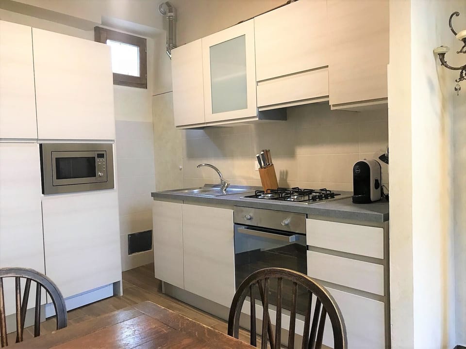 Modern fully equipped kitchen for cooking any meal, includes espresso machine 