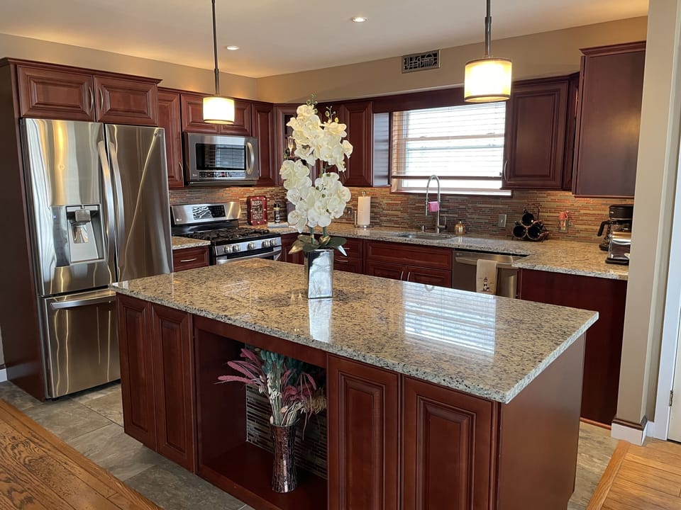 Fully Stocked Kitchen with Stainless Steel Appliances.