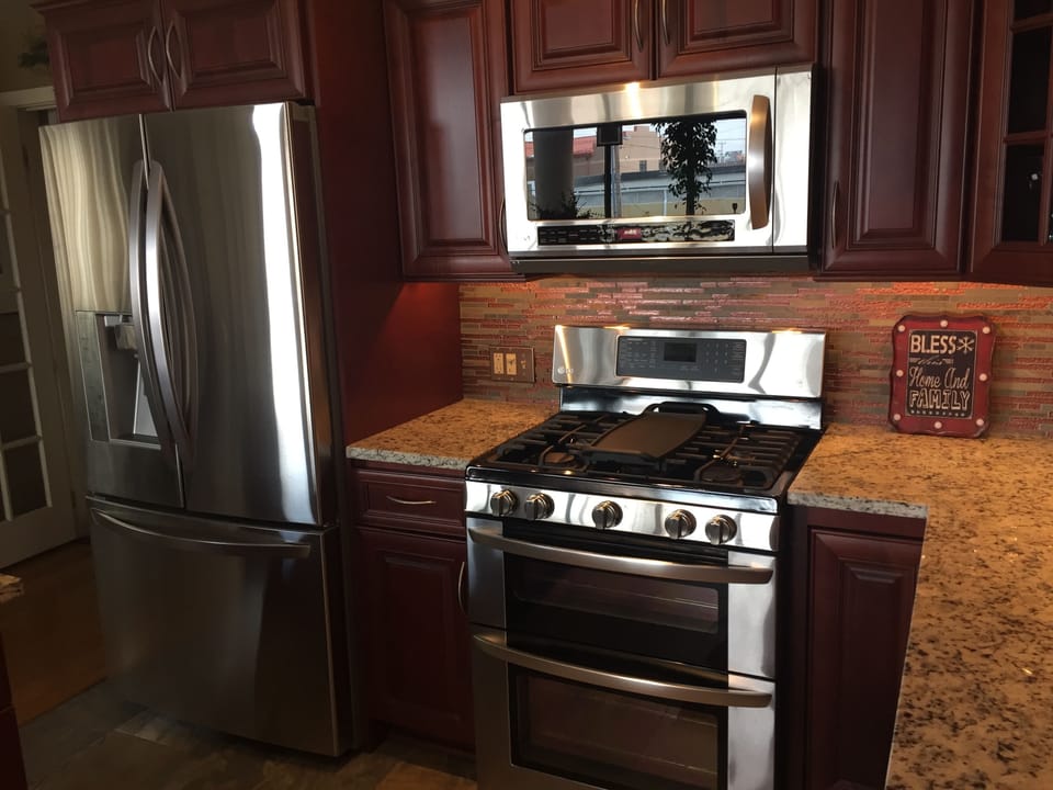 Stainless Steel Appliances, Gas Double Oven, Microwave, French Door Fridge.