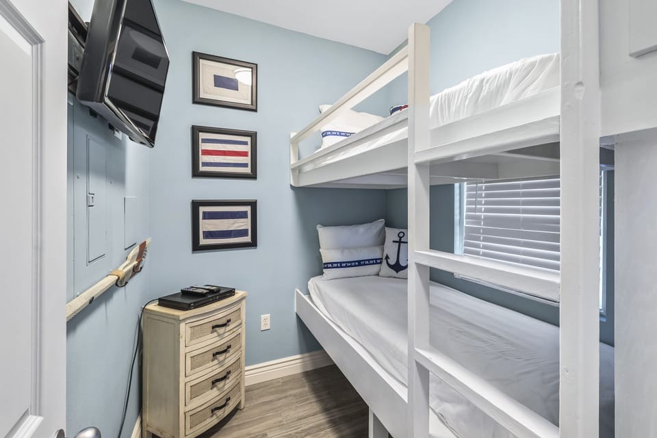 Bunk room with two twin beds, flat screen TV