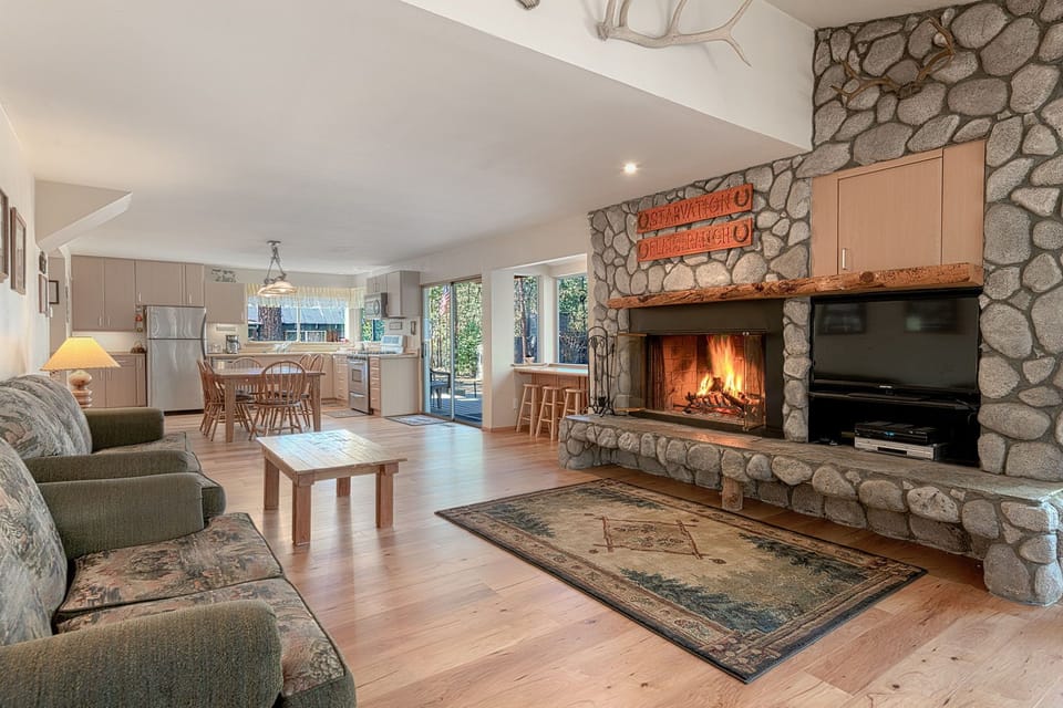 Living room with dining and kitchen area beyond