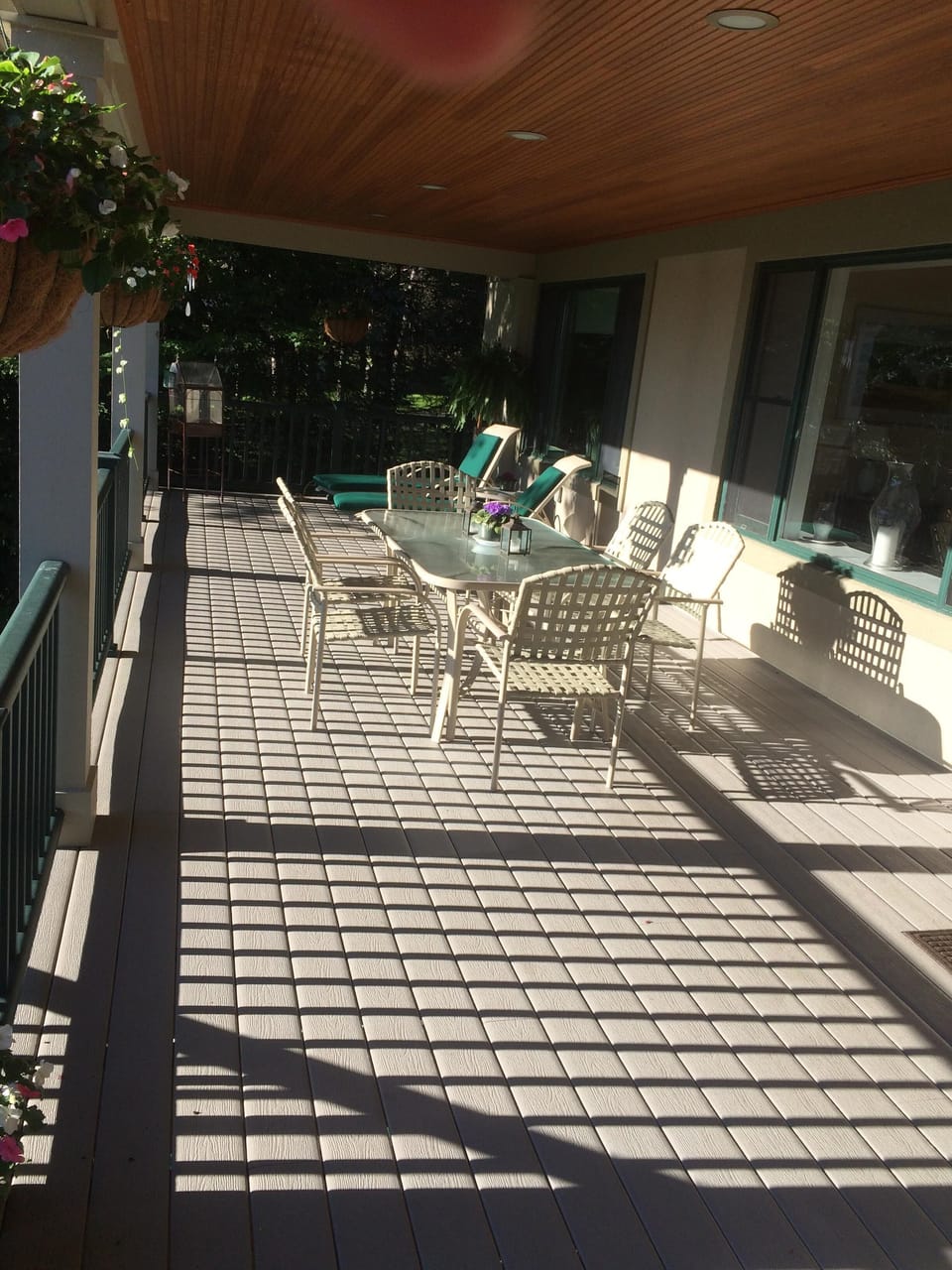back porch has a table for 6 and another screened in area with table for 4-5. 