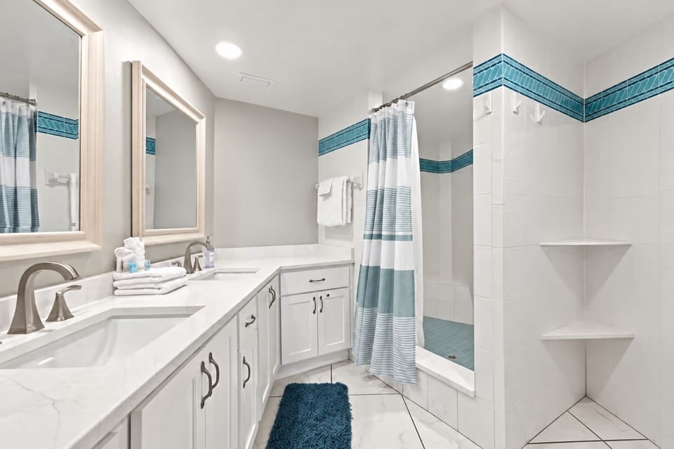 Newly updated spacious primary bathroom. Double sinks and Quartz counter-tops