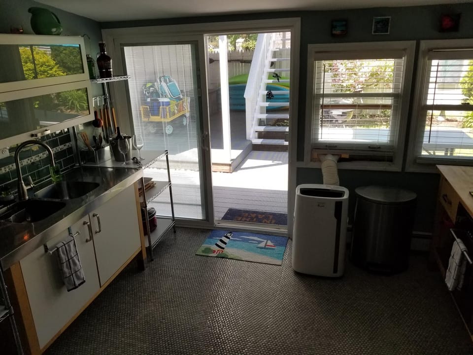 Kitchen with door wall to back deck