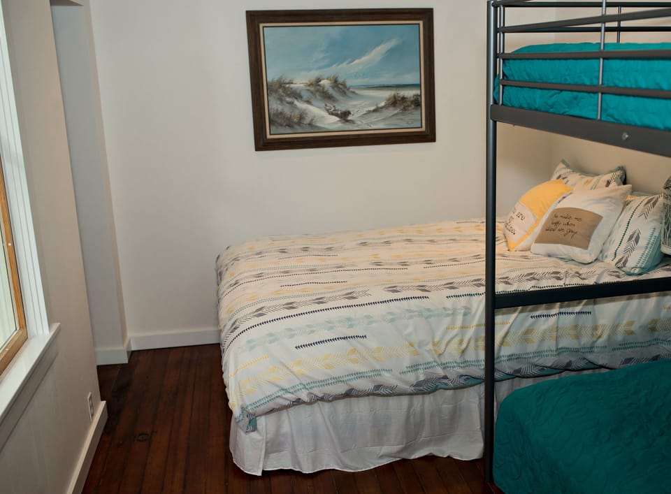 One bedroom with queen bed and bunks.