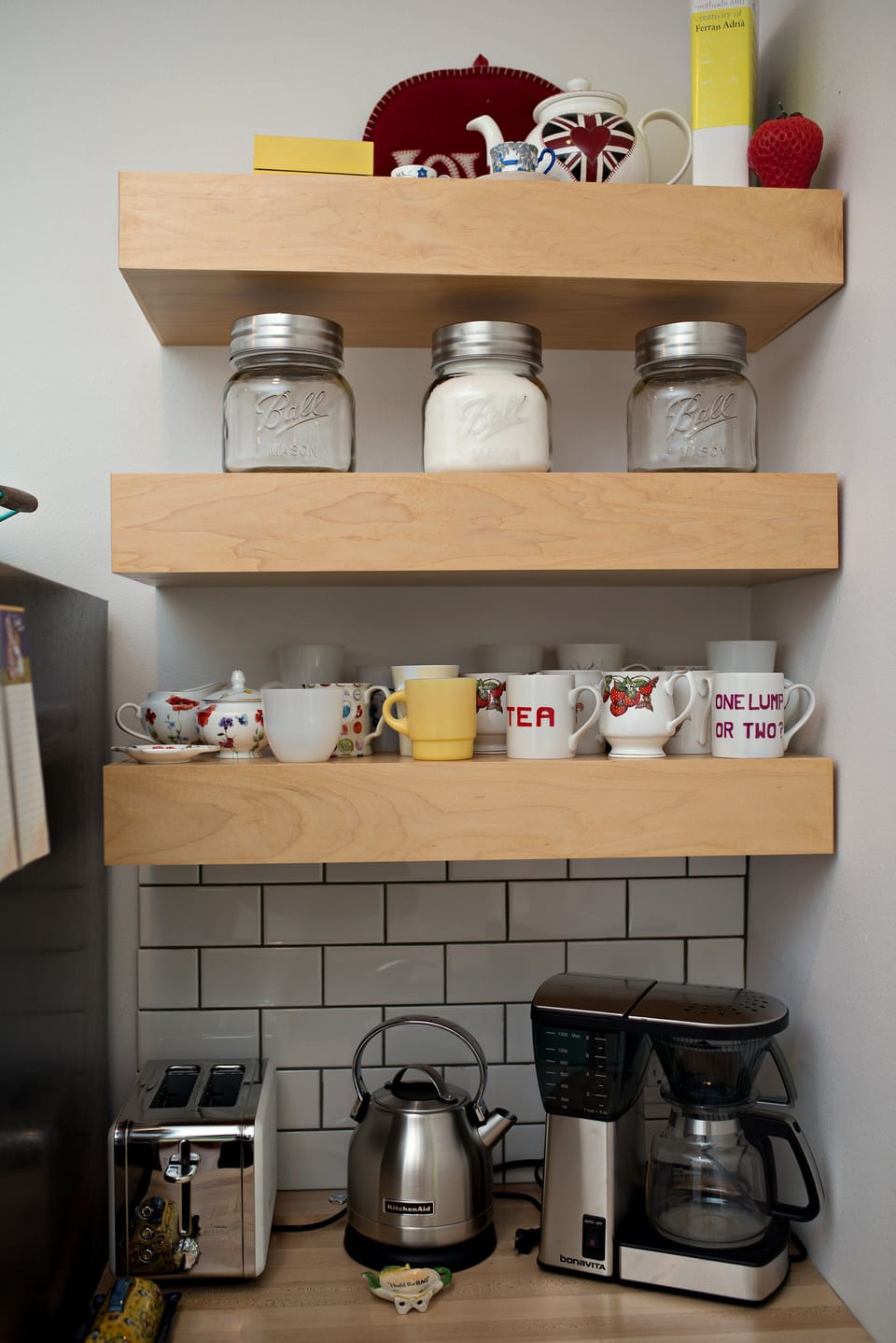 Breakfast nook with kettle, coffee maker and toaster. 