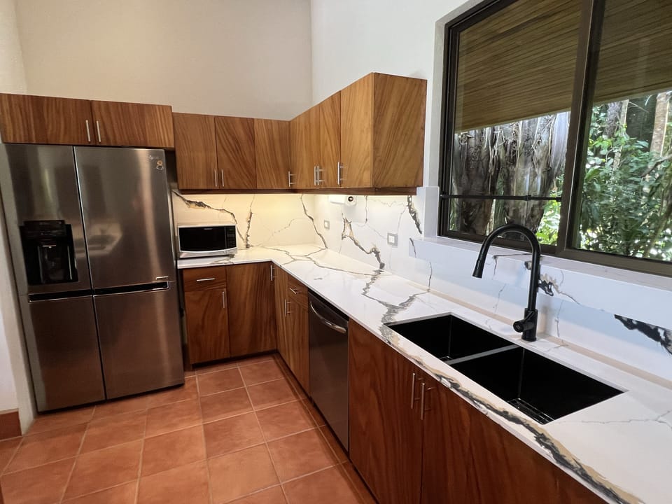 Updated Kitchen with new quartz countertops and backsplash