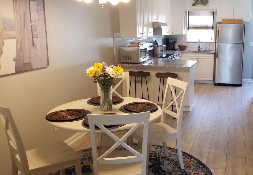 Seating for 4 in the dining room + 2 more at the kitchen peninsula.