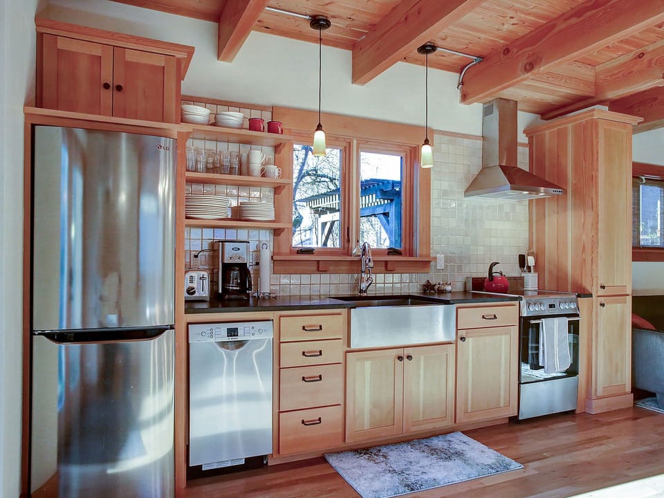 new gourmet kitchen features high end appliances  and granite counters