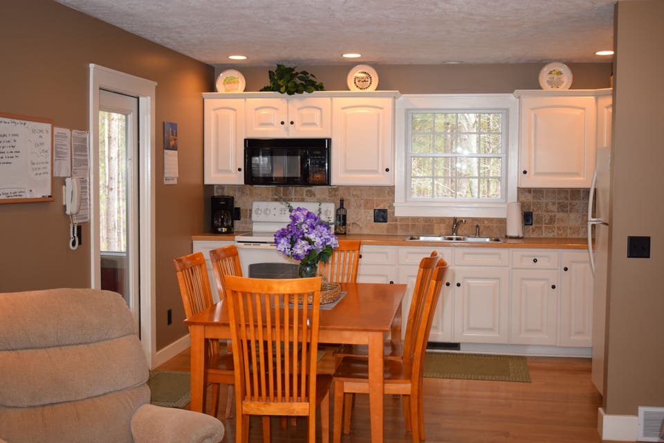 Kitchen/Dining Area  Table opens to seat 10.  Additional chairs are in basement.
