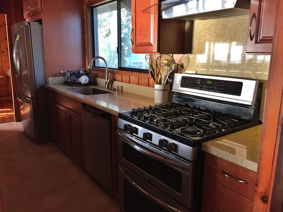 Newly redone kitchen with stainless steel appliances.