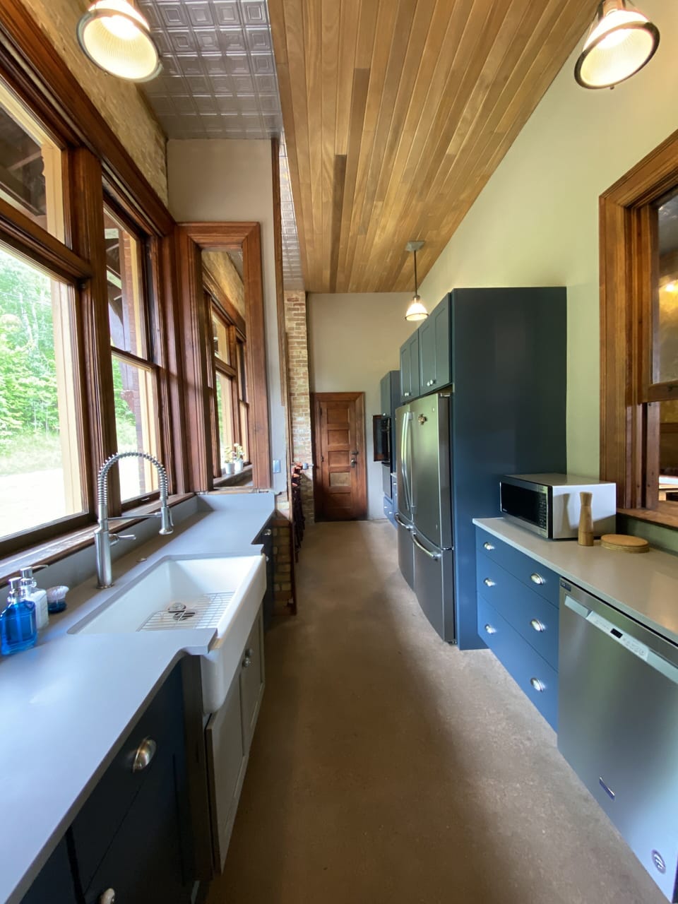 This kitchen is equipped with a gas range, 2 double wall ovens & 2 frig's