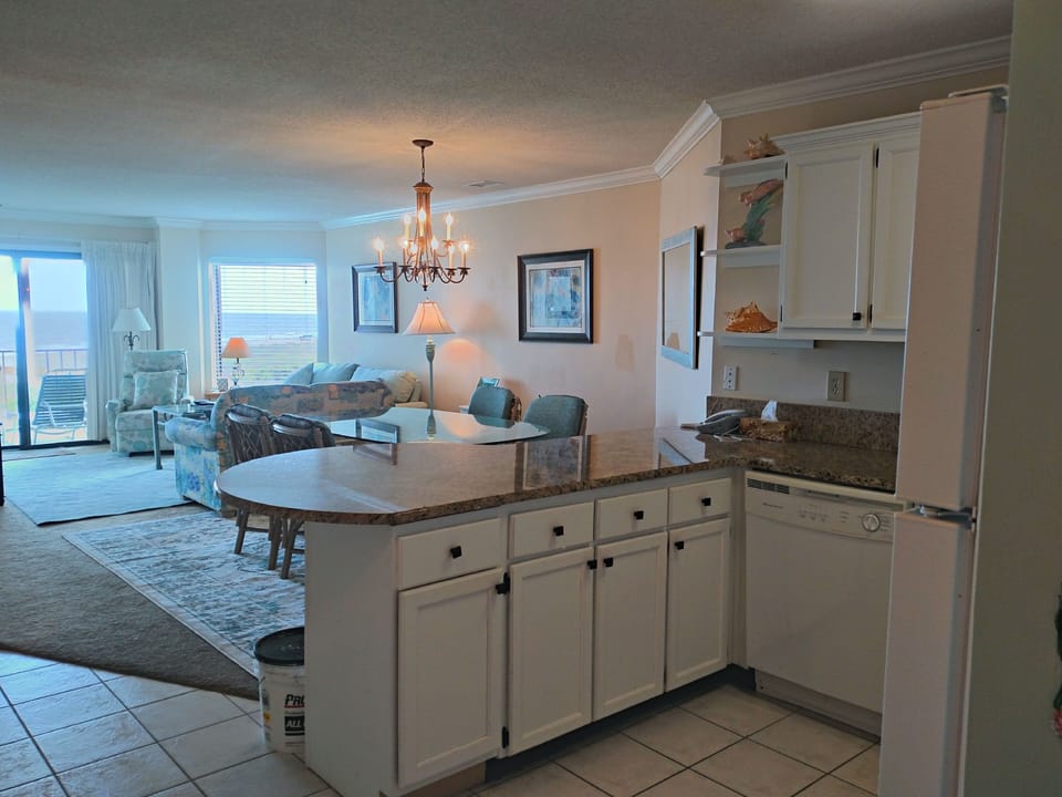 Very open floorplan.  Kitchen overlooking dining room, living room, and ocean