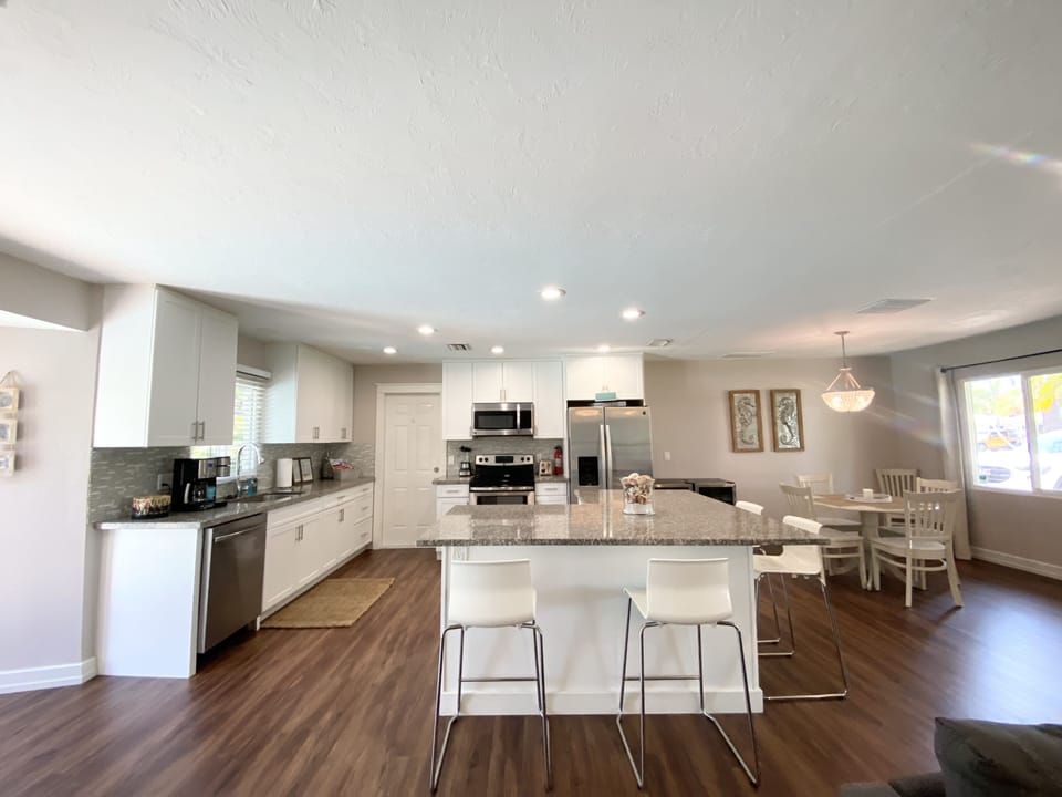 Large kitchen , pool views, granite center island , stainless steel appliances