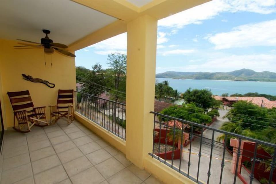 The balcony that is accessed from the bedrooms and living room.