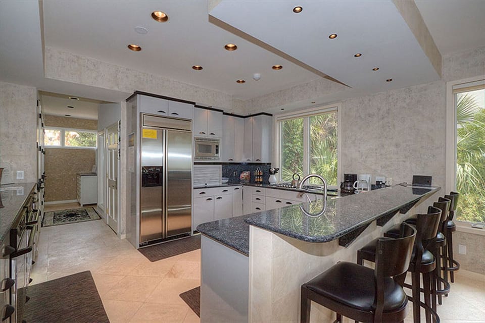 Large fridge, bar with seating for 5, lots of counter space