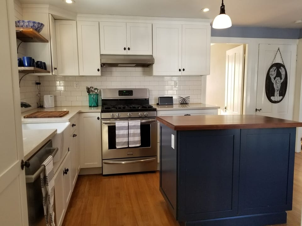 Kitchen with stainless steel appliances and doorway into dining room