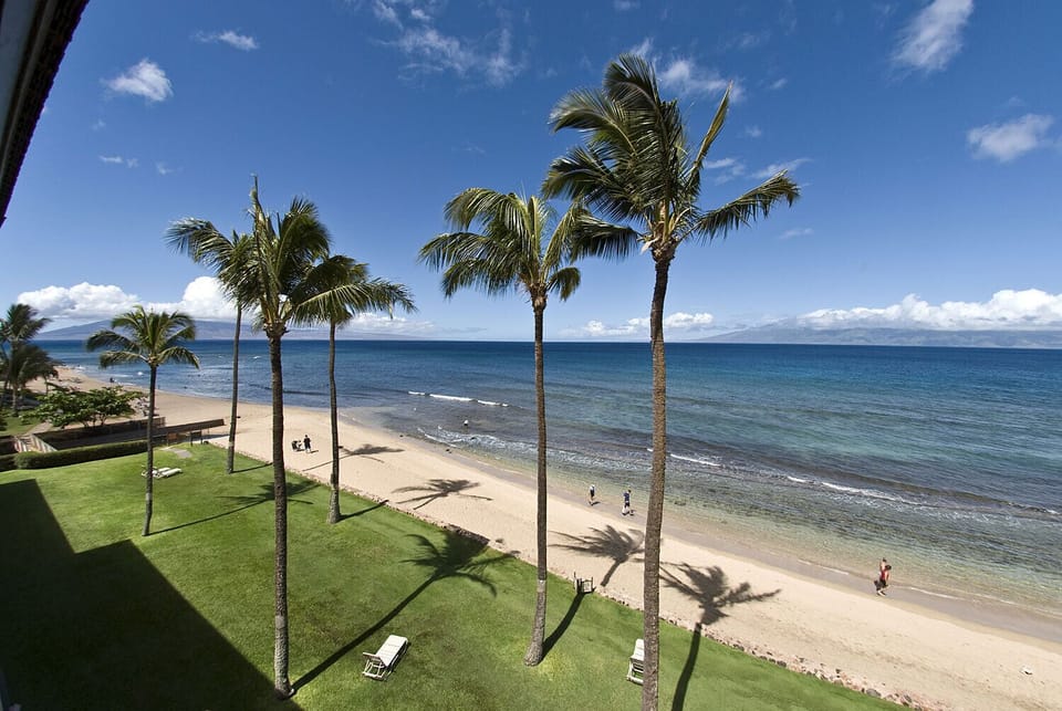 Gaze at the sandy beach and islands of Molokai and Lanai while having coffee.