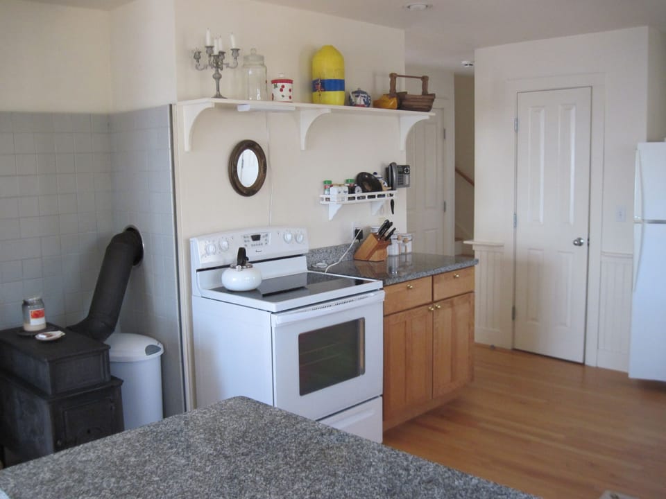 The kitchen is fully equipped for all your cooking and dining needs.