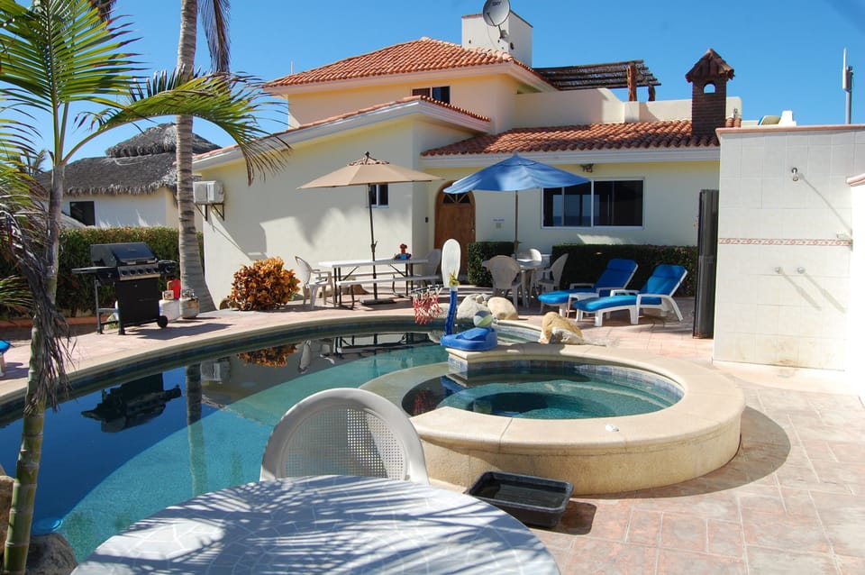 Pool patio with BBQ, lounge chairs, and pool furniture!