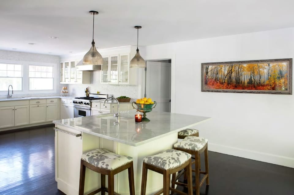 kitchen area with stools 