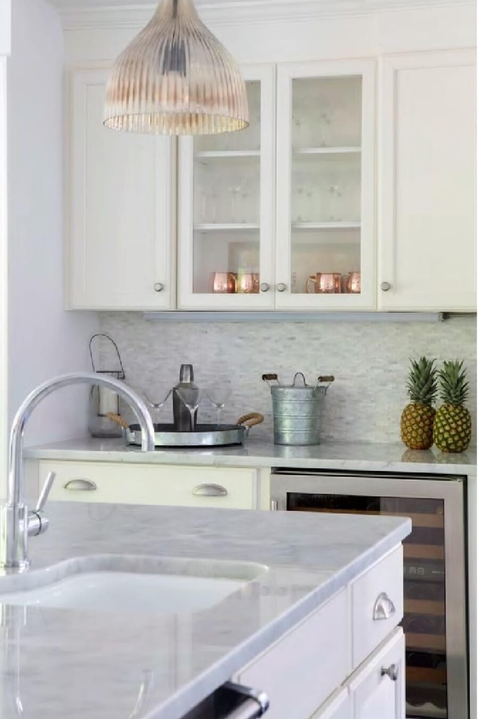 kitchen area ith bar area and wine cooler