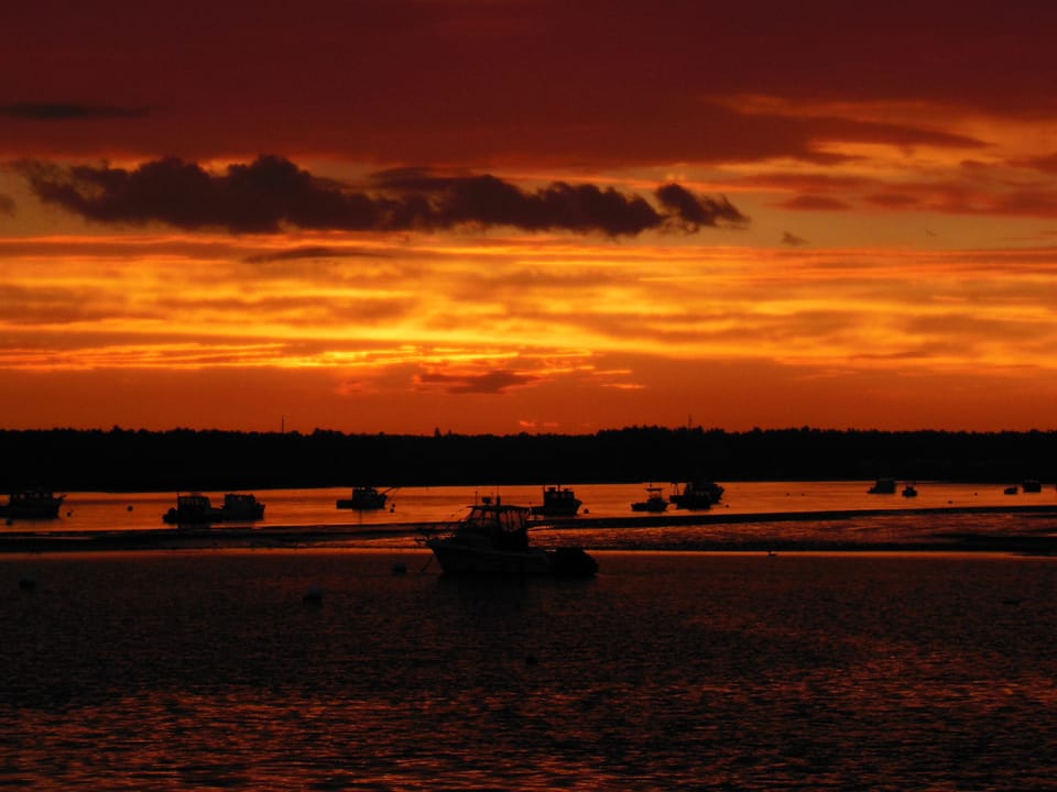 sunset over the harbor from the front of the house