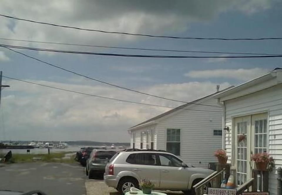 house is 2nd from the end of a dead end street overlooking the harbor