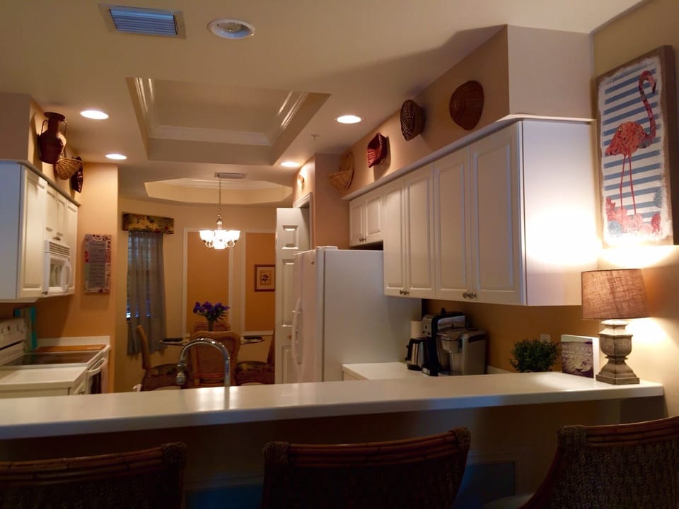Kitchen has 4 swivel bar stools for counter eating plus adjacent dining room!
