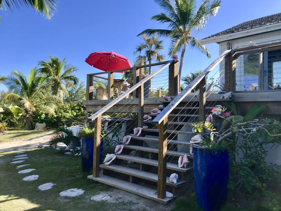 Steps up to the deck and beachfront house. 