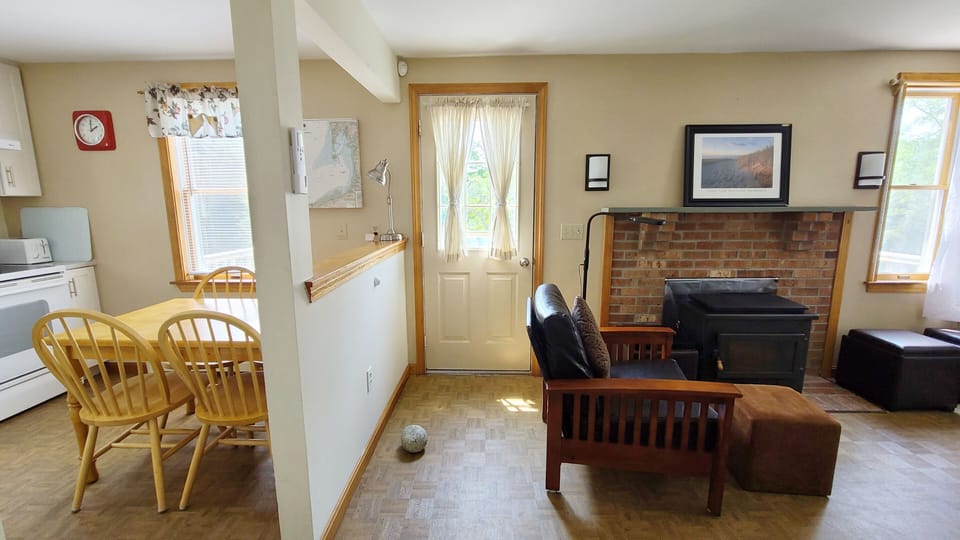 Living room has a futon and large flat screen TV