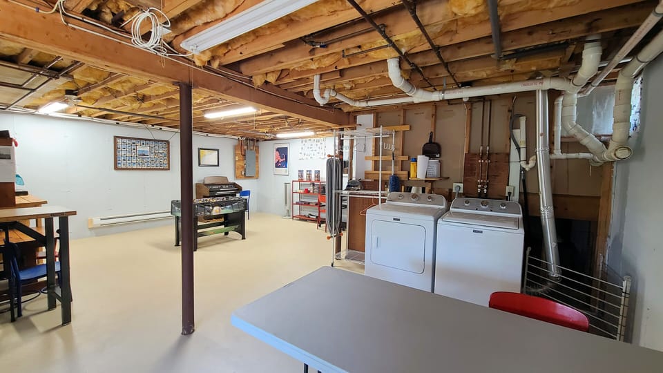 Unfinished basement with washer and dryer