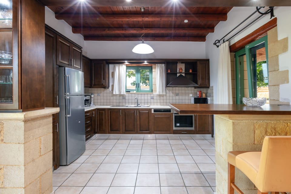 Fully equipped functional kitchen next to the living room