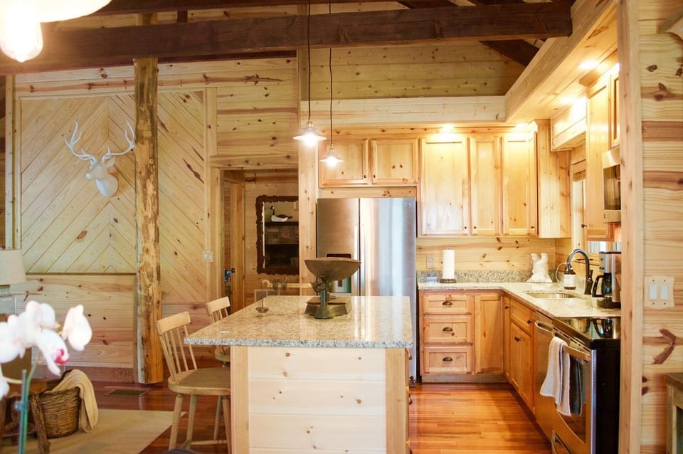Kitchen with new granite counter-tops and large island.