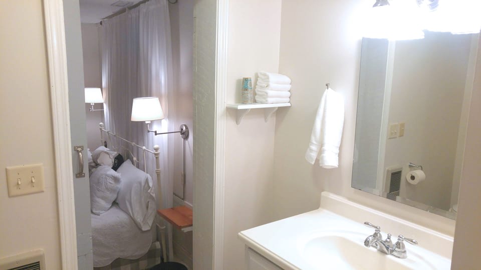 Full bathroom has a laundry nook and updated finishes throughout.
