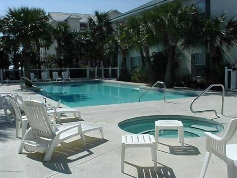 Quiet pool and hot tub, with grill area, less than 60 feet from your door