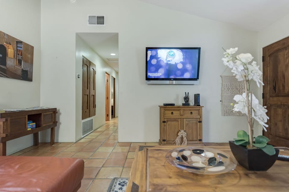 Hallway:  2 bedrooms on right, guest bathroom and master on far left.