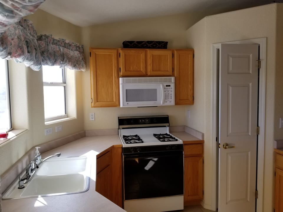Kitchen looks out to the backyard, has walking in pantry and all amenities!