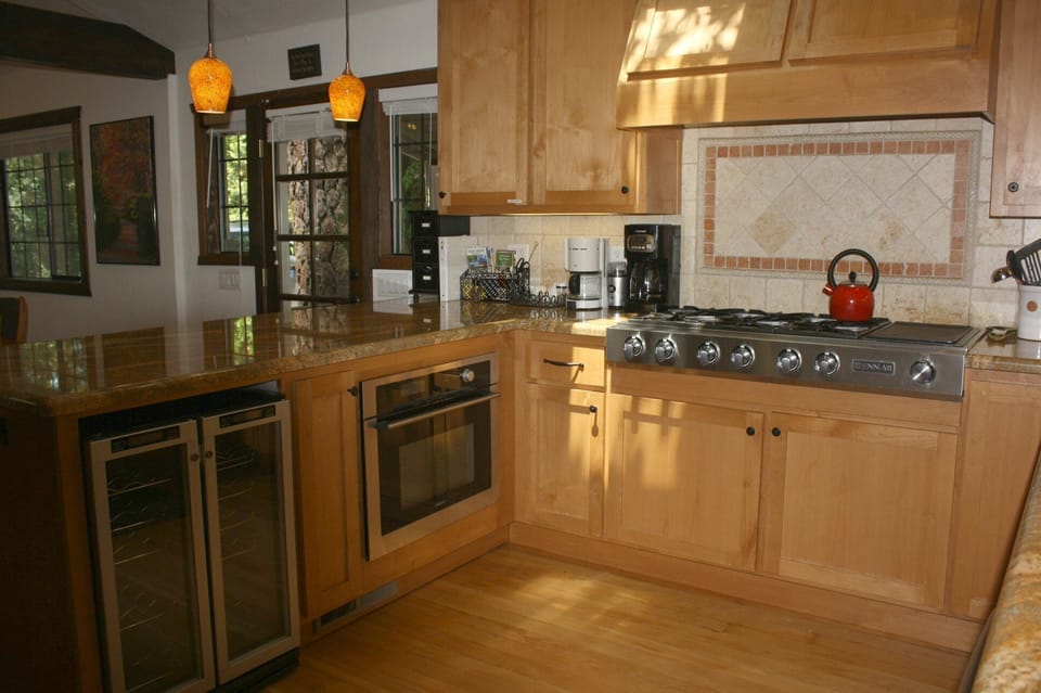 Gourmet kitchen with 6 burner Jenn-Aire stove top with built in griddle